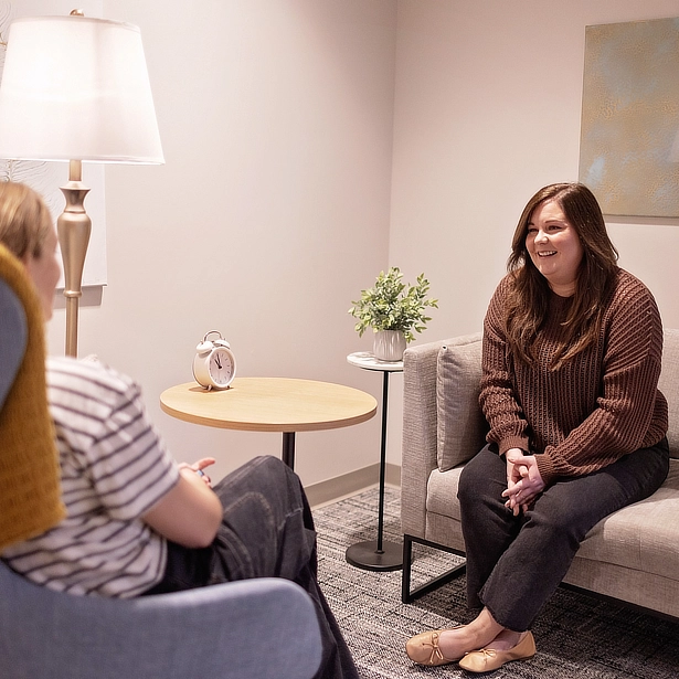 client smiling at therapist